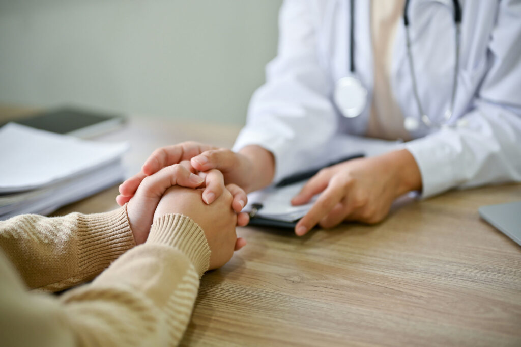 a-pair-of-hands-being-held-during-detox-consultation