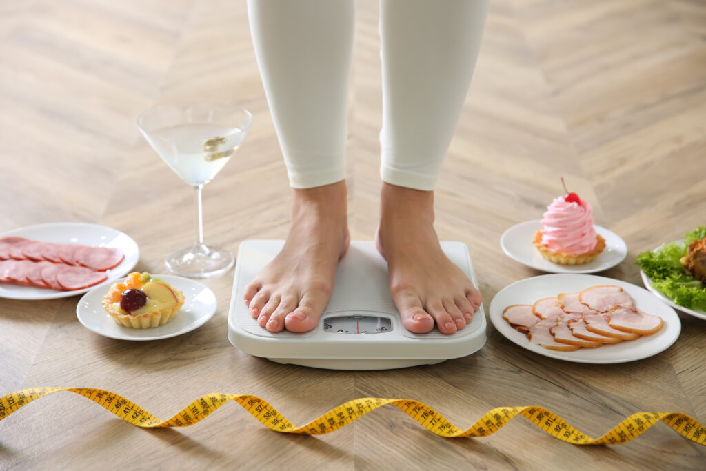 a woman standing on a weighing scale