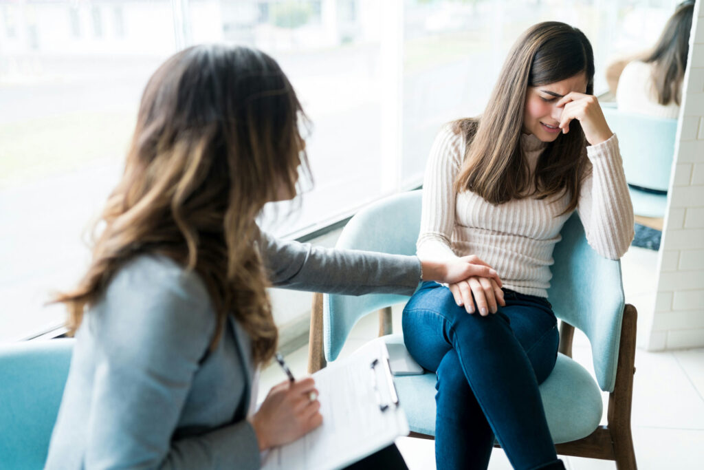 female-patient-being-comforted-by-female-therapist