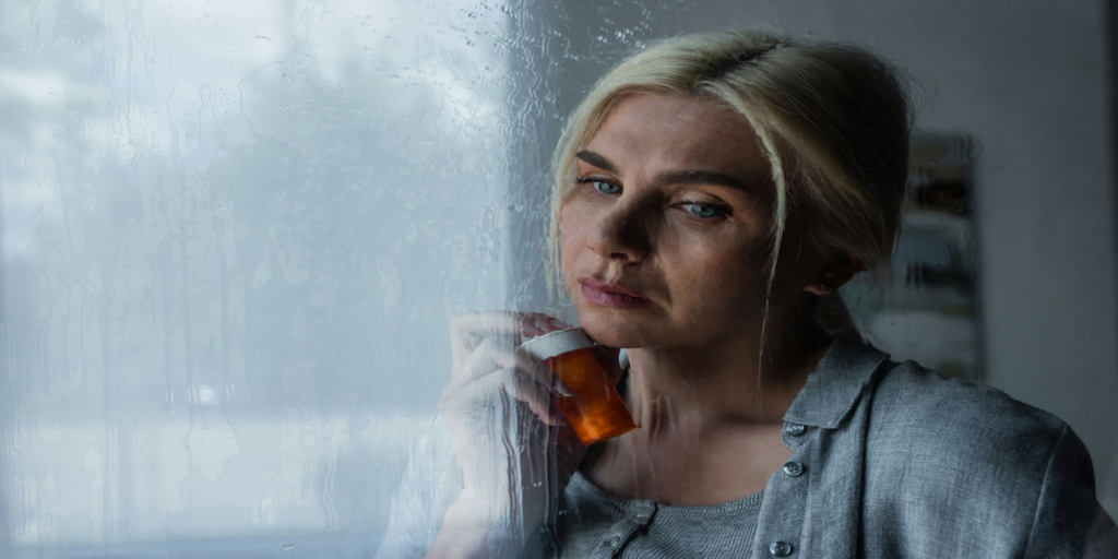 woman-holding-bottle-of-pills