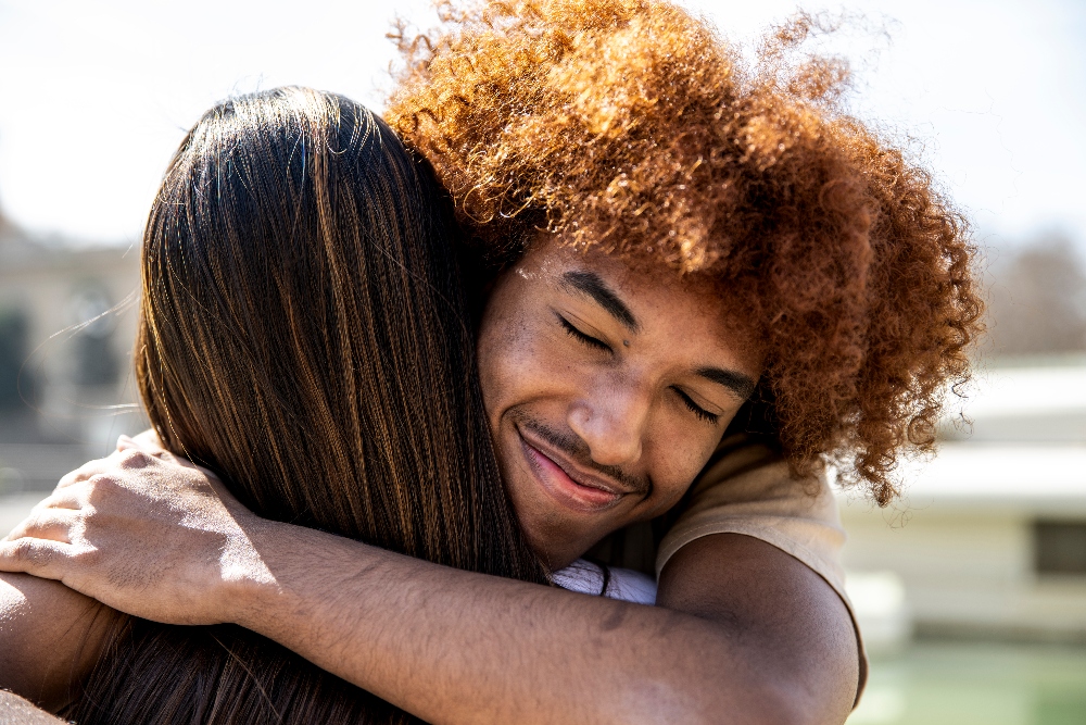 hugging friends