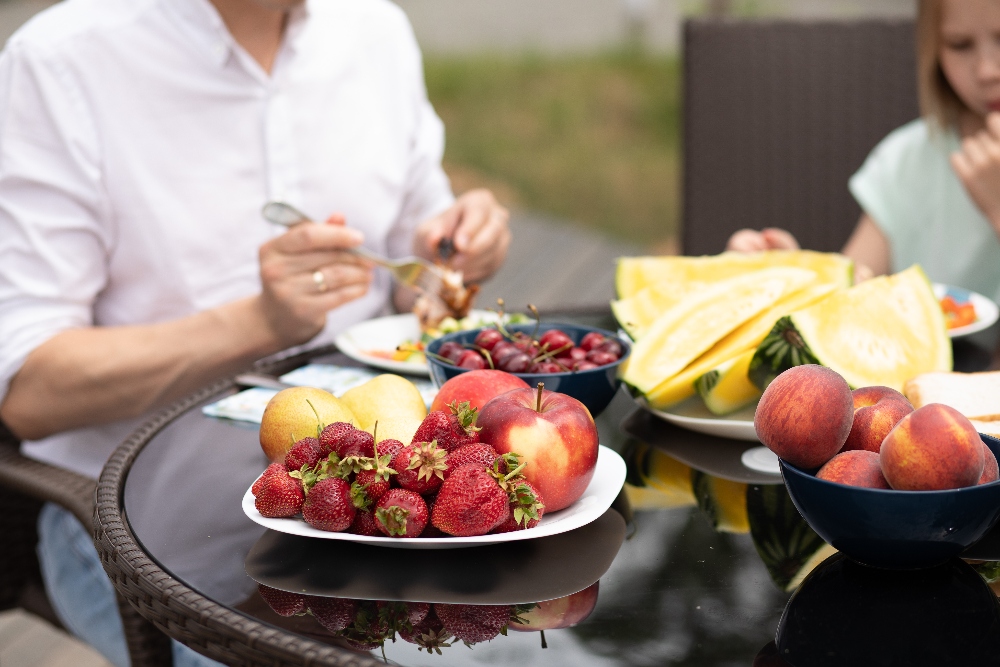 man eating fruit