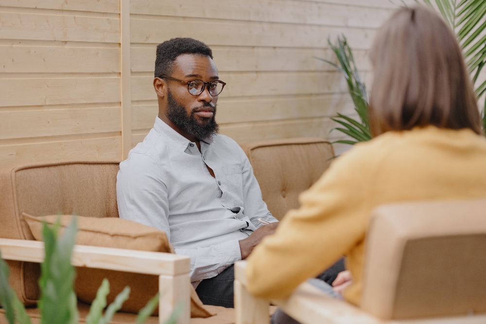man sitting with therapist